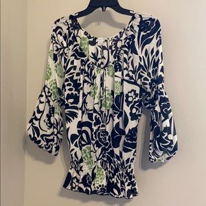 Black, white, and green top